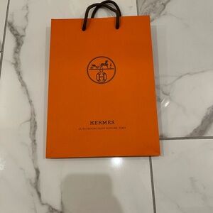 Hermes Vibrant Orange Bag with Black Handles